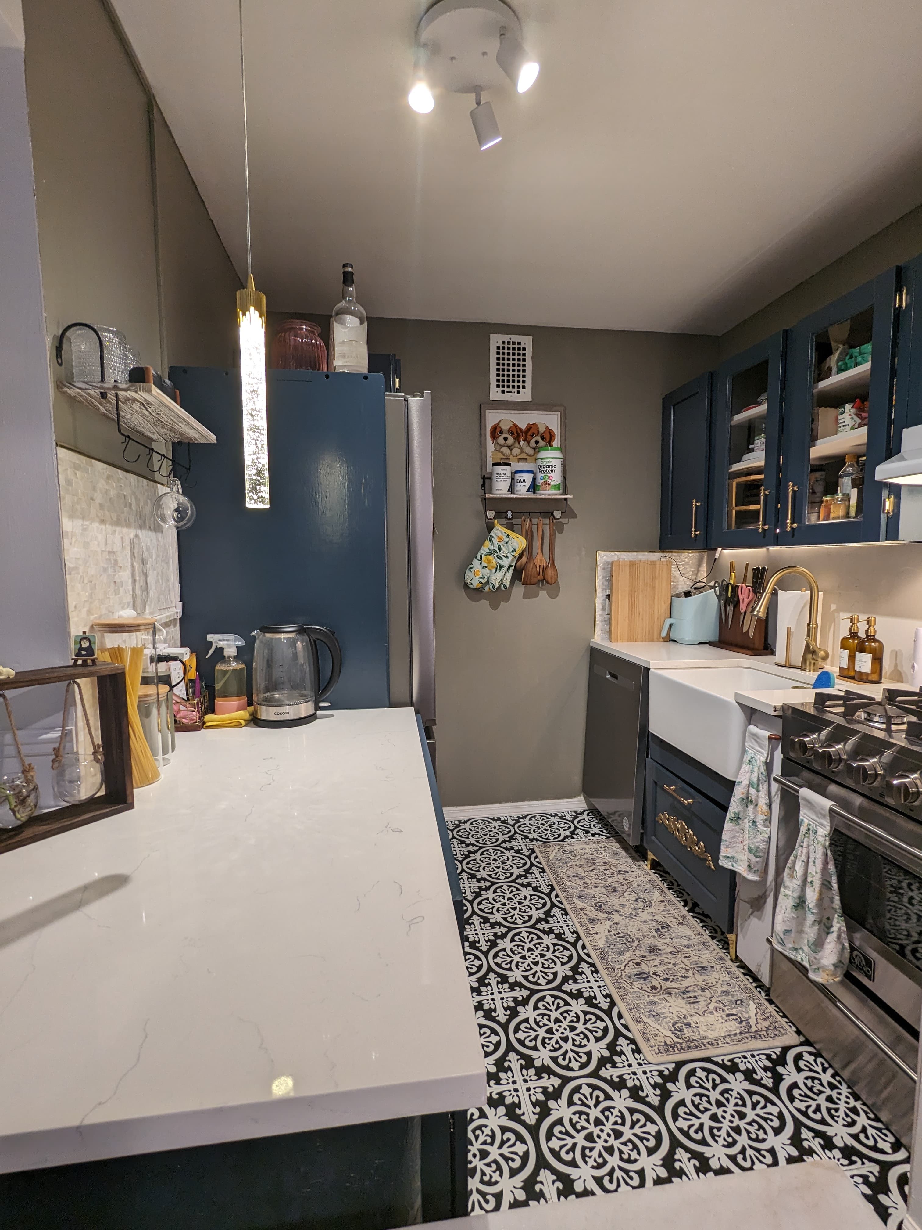 From brown laminate to Gentleman Gray and Carrara quartz